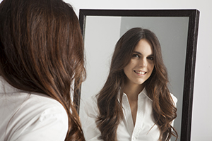 Woman Smiling in Mirror