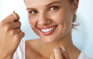 Woman Holding Floss