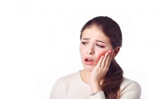 Young Woman with Infected Tooth