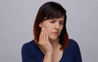 Young Woman with Jaw Pain